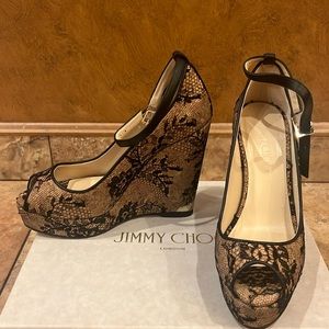 Jimmy Choo black and tan lace platforms.. 5 in heal / 1 inch in front ..